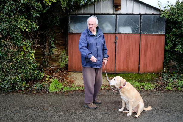 Bobby Thomas and his labrador Kim Bobby Thomas and his labrador Kim